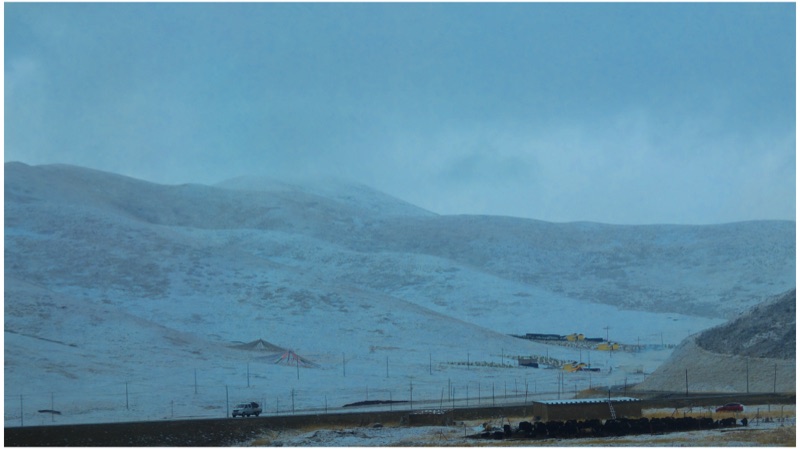 Snowy hills under low cloud